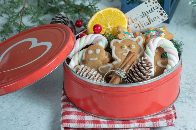 Free photo close up photo of red crockery full with homemade cookies.