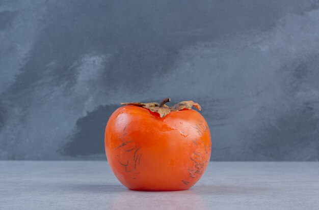 Close up photo of Ripe orange persimmon fruit. 