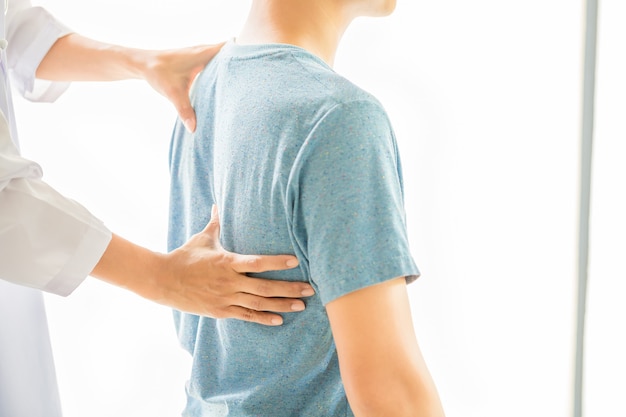 Close up of physiotherapist working with patient in clinic Free Photo