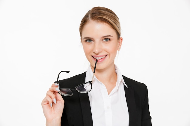 Close up picture of smiling blonde business woman holding eyeglasses 