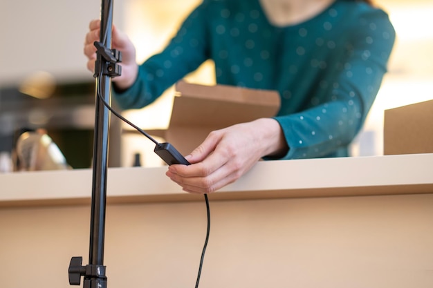 Close up picture of a woman fixing camera