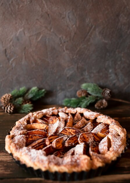 Close-up of pie with crust and pine cones