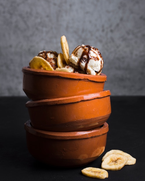 Close-up pile of bowls with ice cream scoops