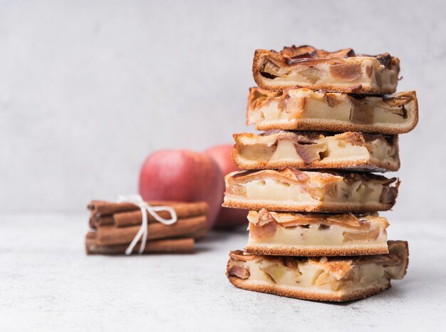 Close-up pile of cake slices and apples