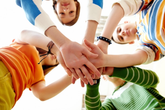 Close-up of pile of hands of friends