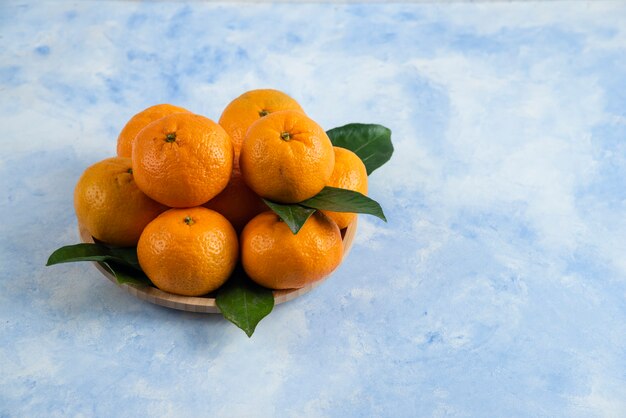 Close up Pile of mandarins with leaves