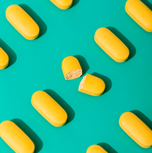 Close-up of pills with a broken one