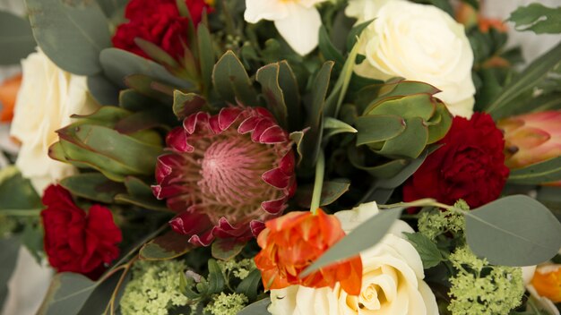 Close-up of pink gerbera and rose flower in the bouquet