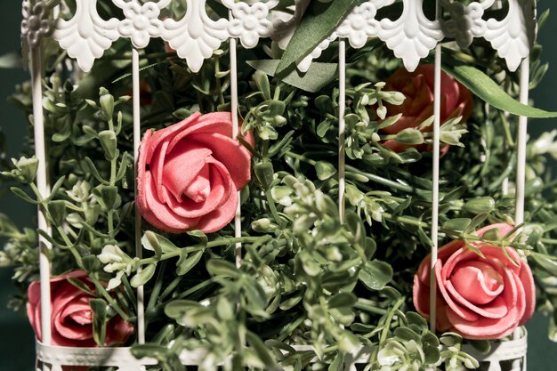 Close up pink roses in cage