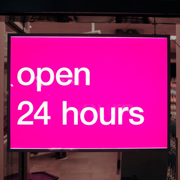 Close-up pink sign for open 24 hours