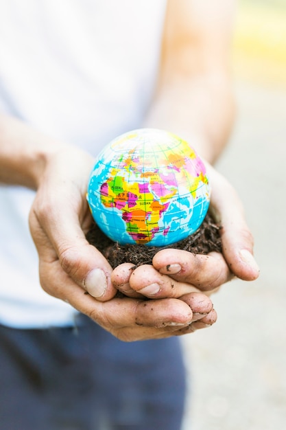 Close up planet model in hands