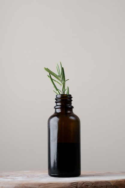 Free photo close-up plastic bottle with rosemary