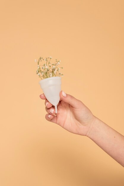 Close up plastic cup with flowers