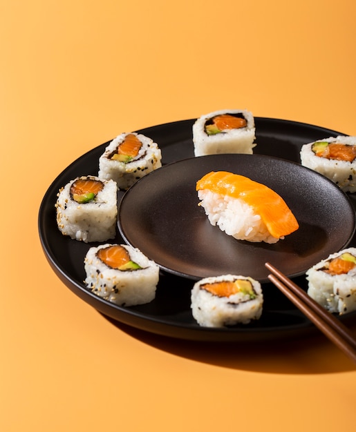 Close up plate of sushi rolls with nigiri