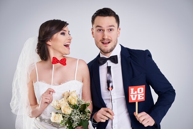 Close up of playful bride and bridegroom