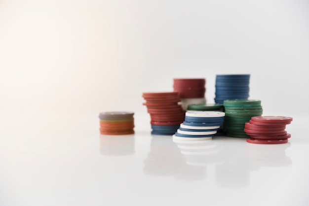 Close-up poker chips on white background