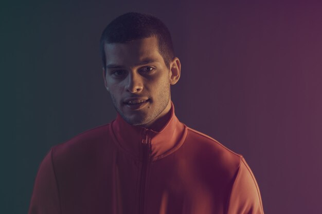 close-up portrait of attractive male model. Color flash  light