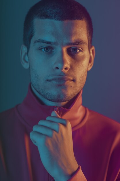 close-up portrait of attractive male model. Color flash  light