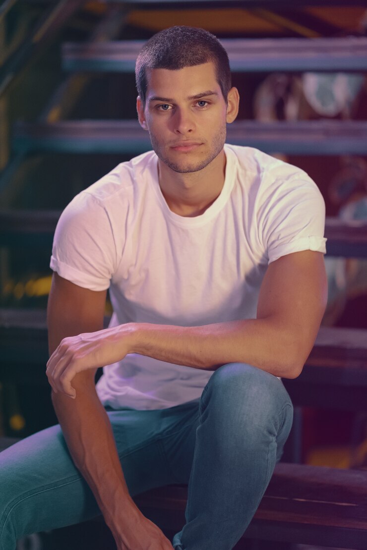Free Photo close-up portrait of attractive male model. young handsome man in a bar