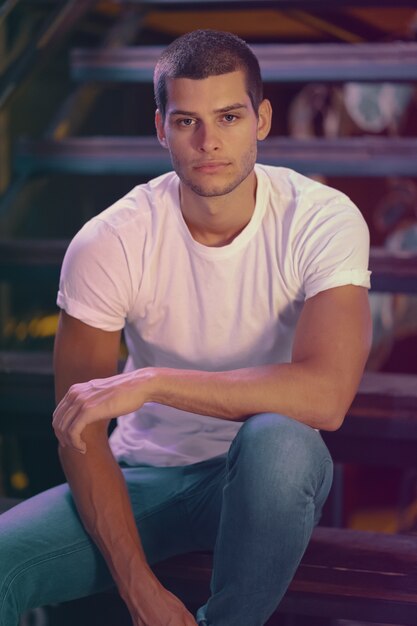 Close-up portrait of attractive male model. Young handsome man in a bar