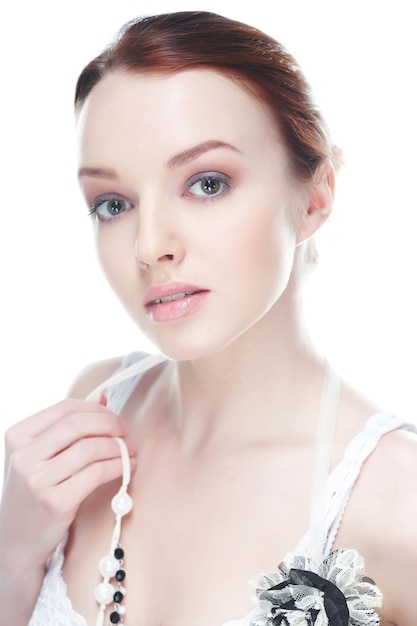 Close-up portrait of awesome brunette woman isolated on white background.