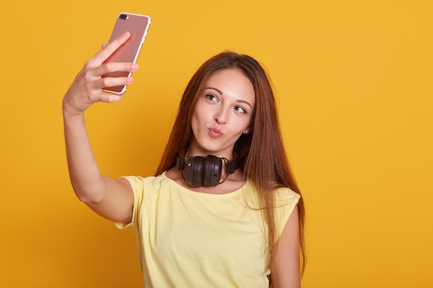 Close up portrait of beautiful amazing lady making selfie via telephone