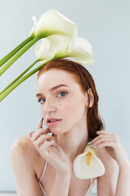 Close up portrait of a beautiful redheaded woman posing