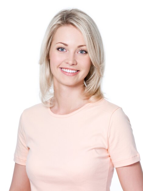 Close-up portrait of a beautiful smiling young woman with toothy smile