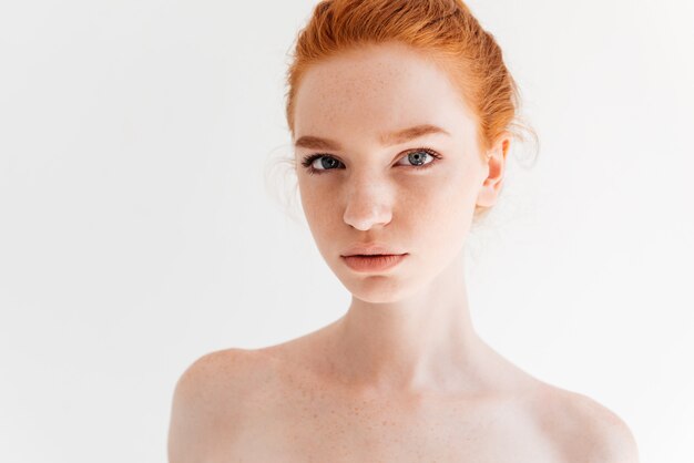Close up portrait of beauty naked ginger woman looking