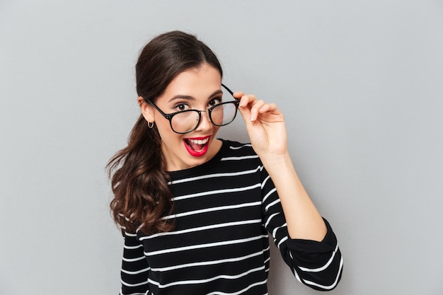 Close up portrait of a cheerful woman in eyeglasses