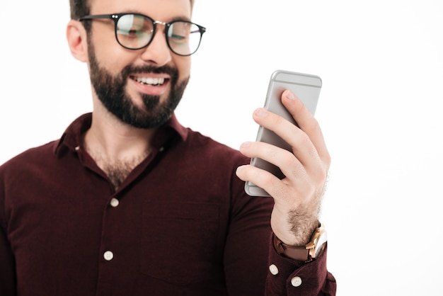 Close up portrait of a cheerful young man in eyewear