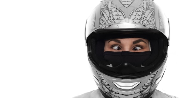 Free photo close up portrait of crazy wowan with extereme life. lady in motorcycle helmet on white background. strabismus young girl. copy space.