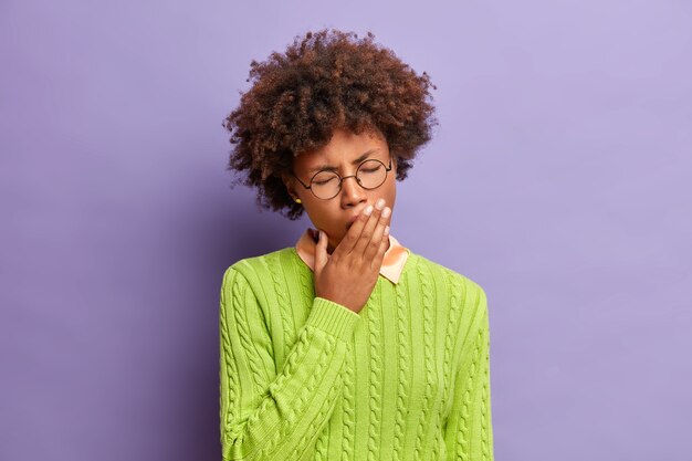 Close up portrait of curly haired young woman isolated