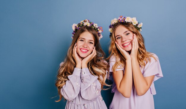 Close-up portrait of ecstatic white women having fun together