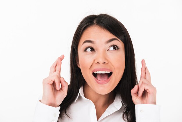 Close up portrait of an excited asian businesswoman