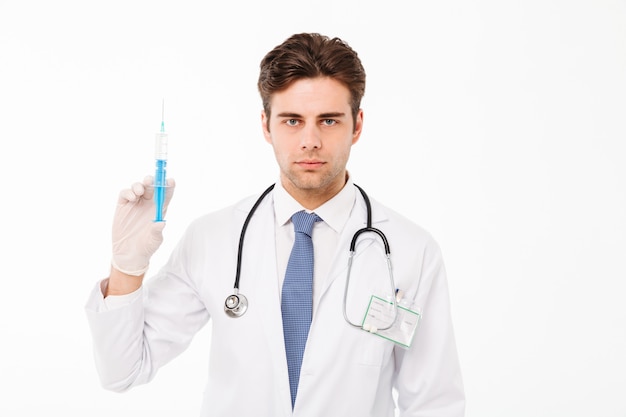 Close up portrait of a focused young male doctor