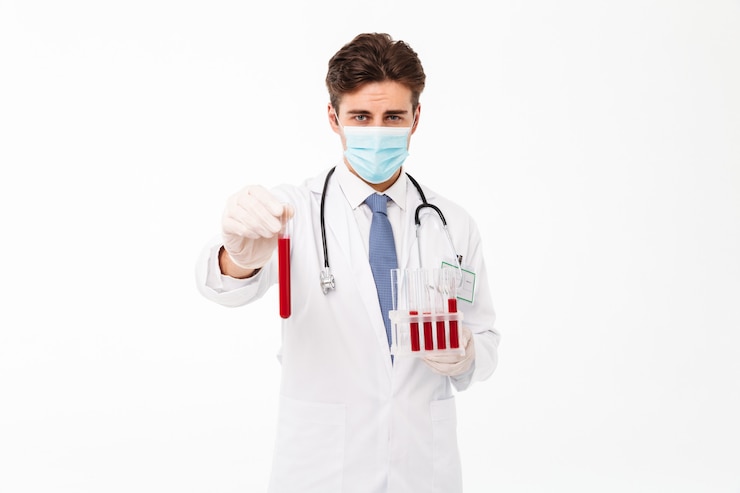 Free Photo close up portrait of a focused young male doctor