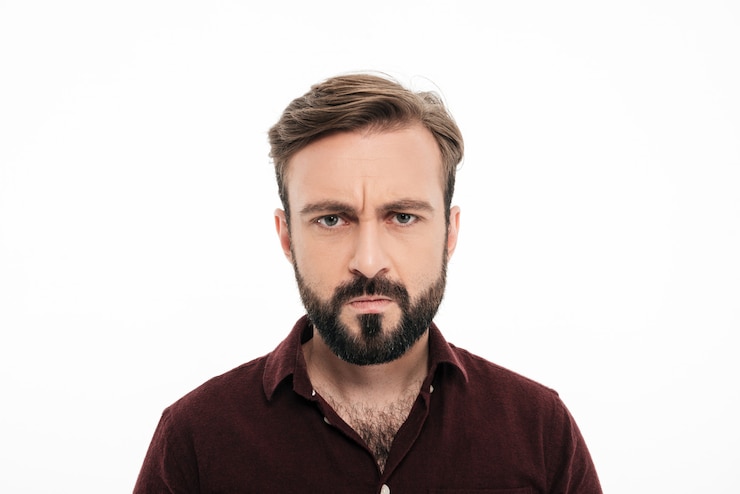 Free Photo close up portrait of frowning angry bearded man