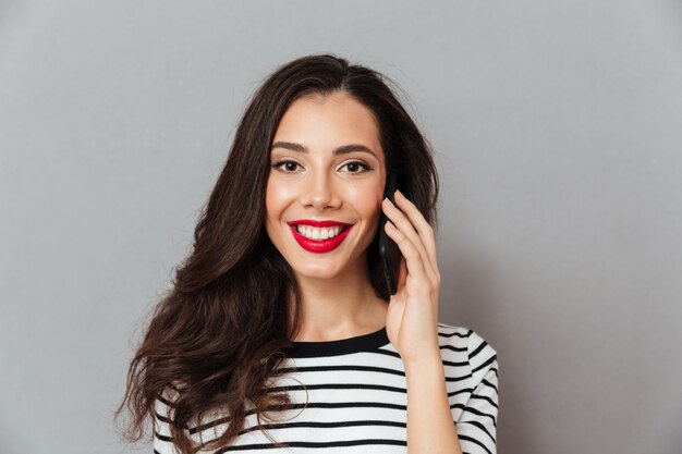 Close up portrait of a girl talking on mobile phone