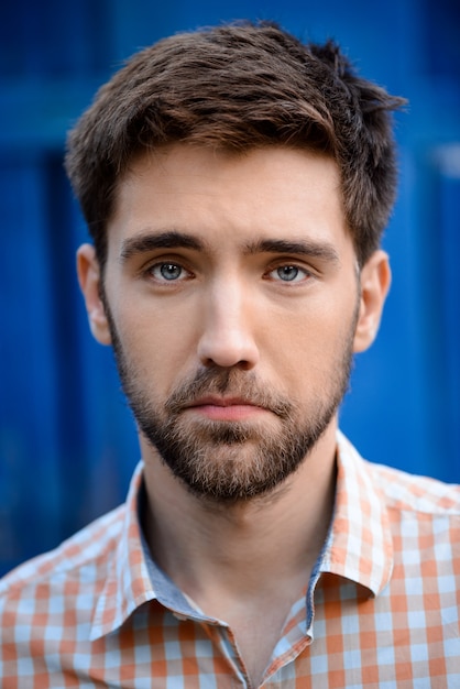 Close up portrait of handsome man upset