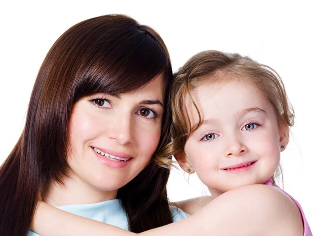 Close-up portrait of happy family of beautiful mother with daughter - white space