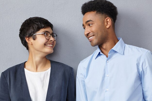 Close up portrait of interracial business couple dressed formally