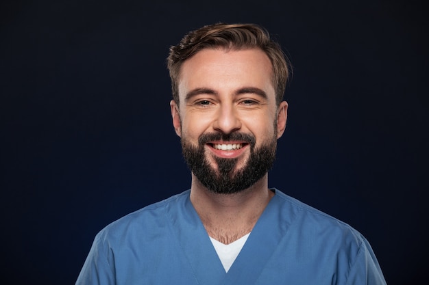 Free photo close up portrait of a joyful male doctor