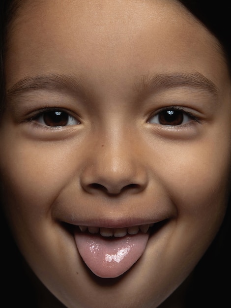 Free photo close up portrait of little and emotional asian girl.