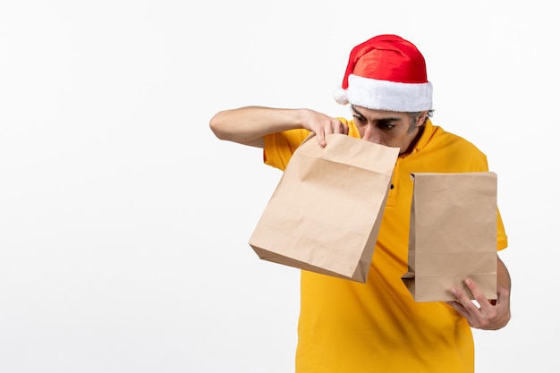 Close up portrait of male courier wearing Santa hat isolated