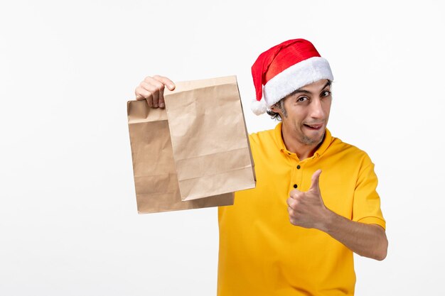 Close up portrait of male courier wearing Santa hat isolated