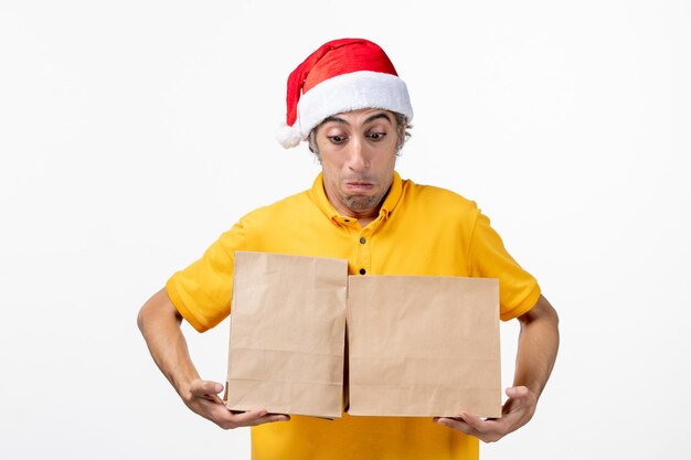 Close up portrait of male courier wearing Santa hat isolated