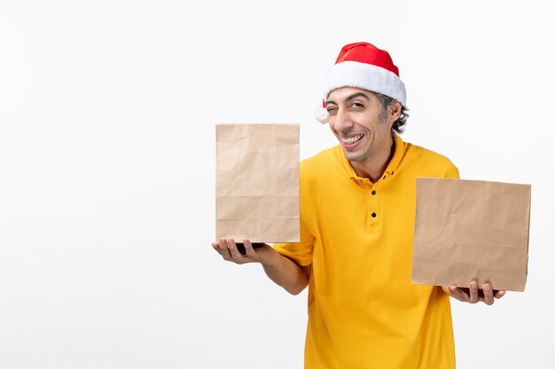 Close up portrait of male courier wearing Santa hat isolated