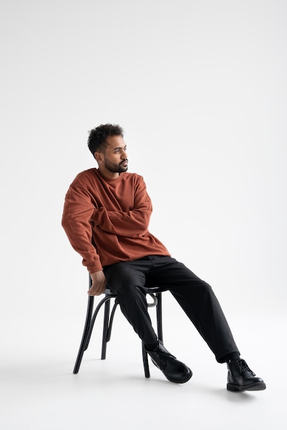 Confident Thoughtful Man In Elegant Suit Posing Sitting In Chair Stock Photo,  Picture and Royalty Free Image. Image 123840231.