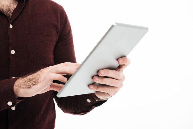 Close up portrait of a man using tablet computer